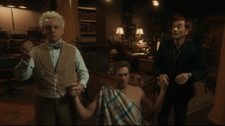 Aziraphale, Gabriel, and Crowley holding hands