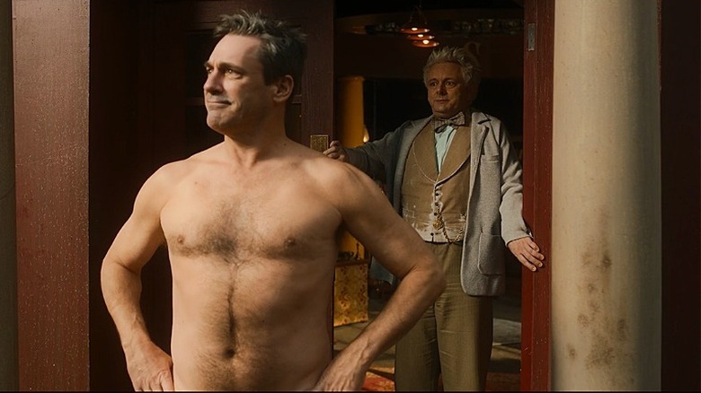 Gabriel posing shirtless with Aziraphale in doorway