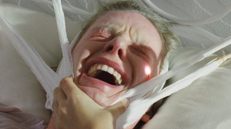 Susanne Wuest screaming on bed