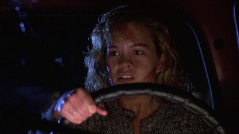 Bloodied Rachel driving car