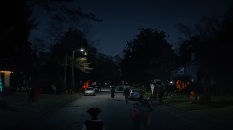 People walking through Haddonfield at night