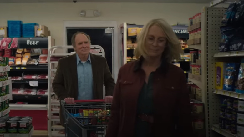 Laurie and Frank walking through the store