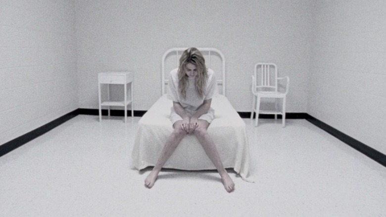 Laurie sitting in white room