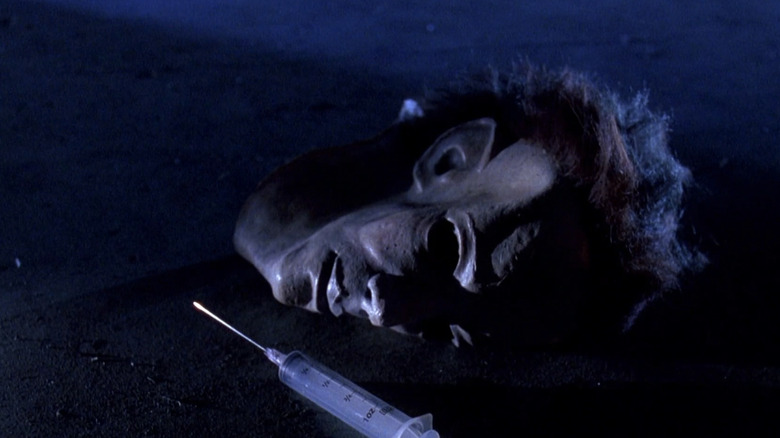 Michael's mask lays on the ground