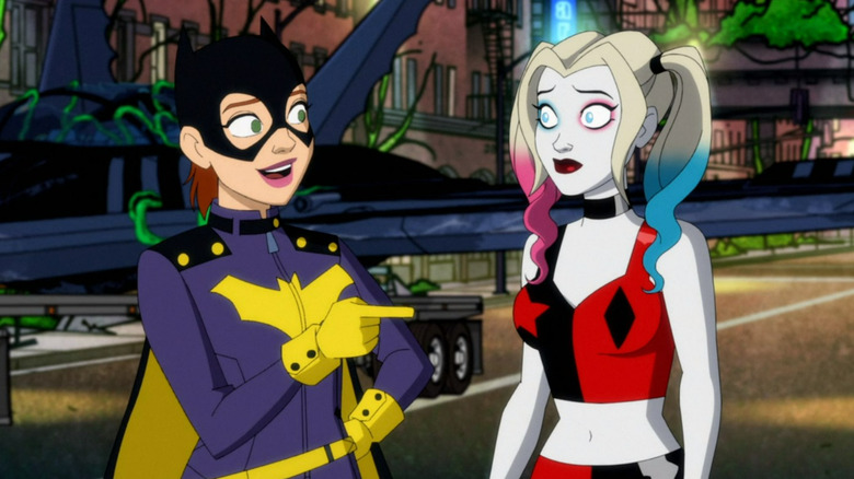 Batgirl pointing at Harley Quinn