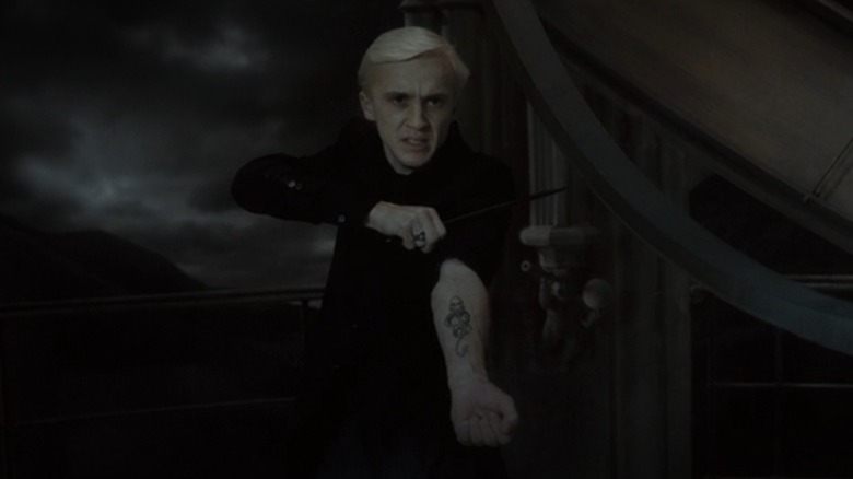 Draco Malfoy shows Dark Mark