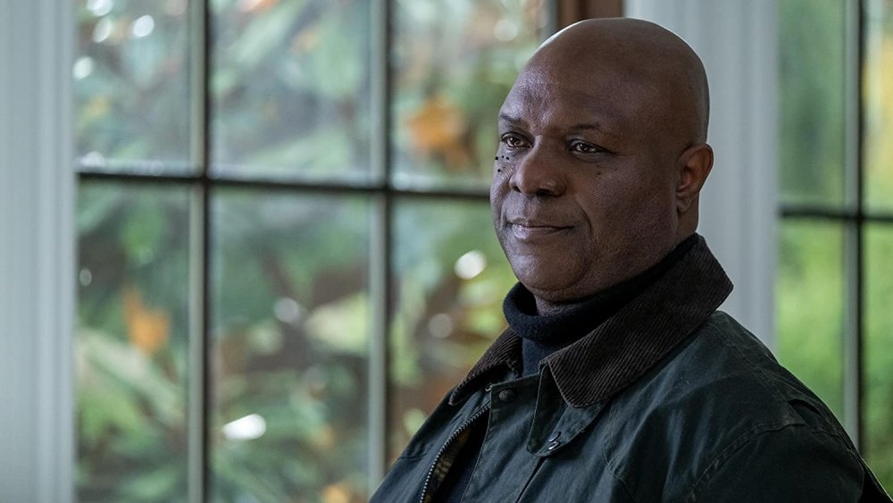 Robert Wisdom as the Caretaker