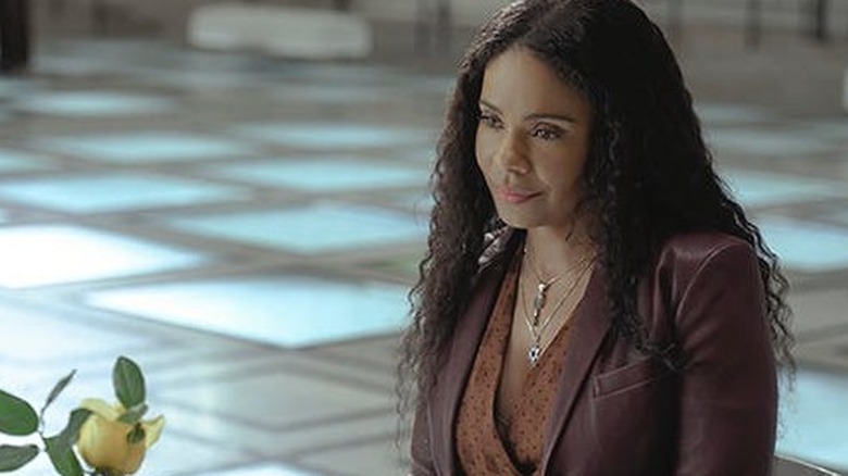 Sanaa Lathan in brown leather jacket