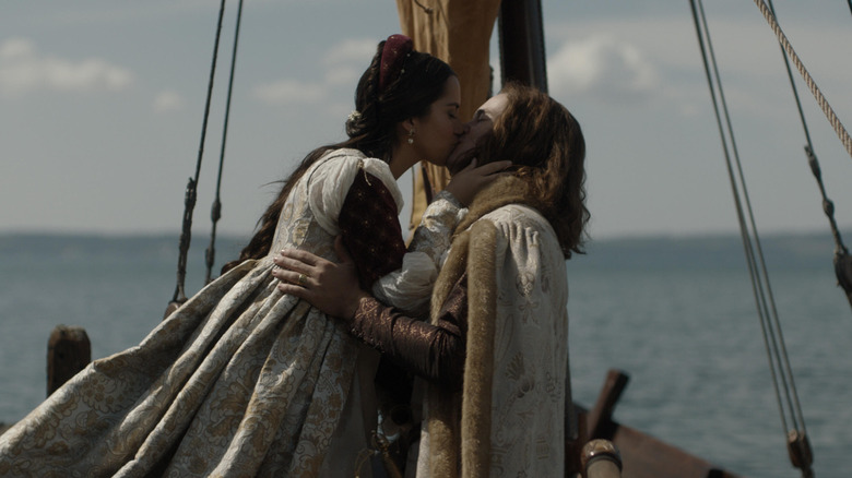 Juliet kisses Romeo on a boat at sea