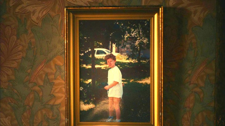 A childhood photo of Jake hanging on the wall in "I'm Thinking of Ending Things"