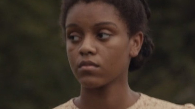 An unknown Black girl with a straight face