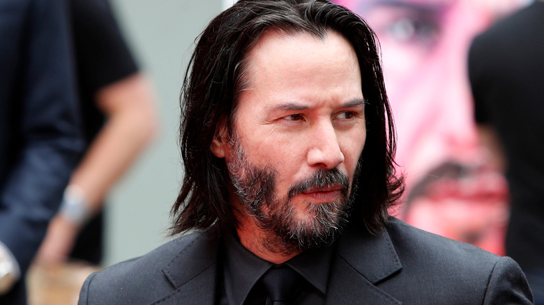 Keanu Reeves looking to the side