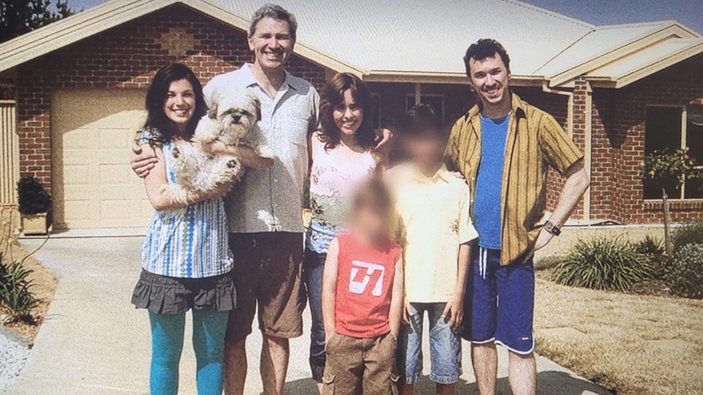 Alice and Russell Palmer smiling with the Toohey family