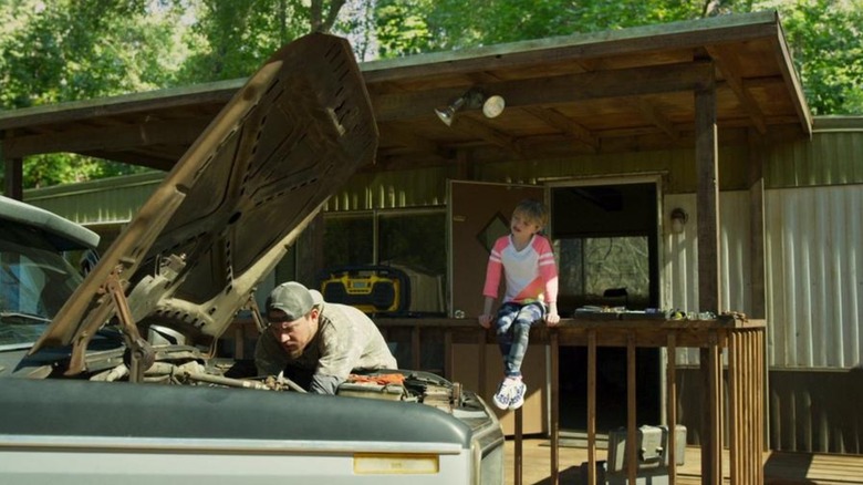 Jimmy fixing car with Sadie