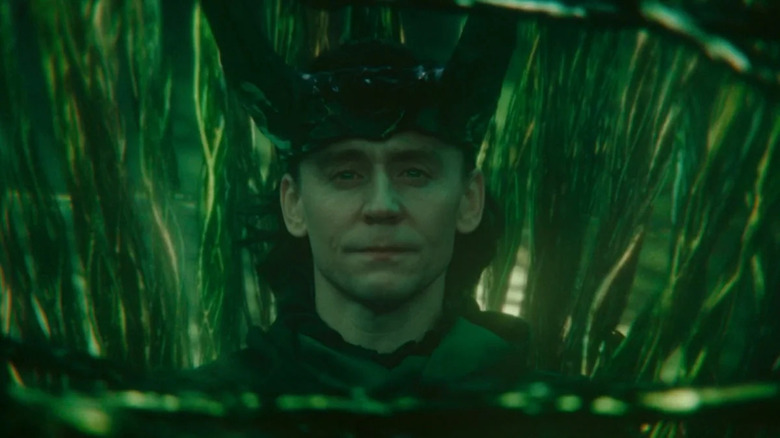 Loki amidst green timeline branches