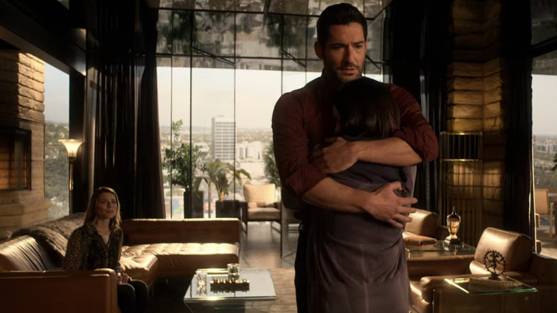 Lucifer hugging his daughter