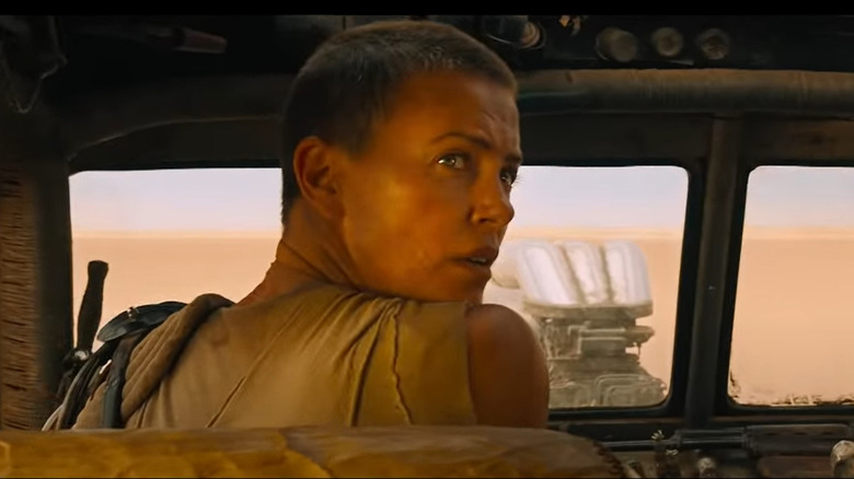 Charlize Theron as Furiosa looking back