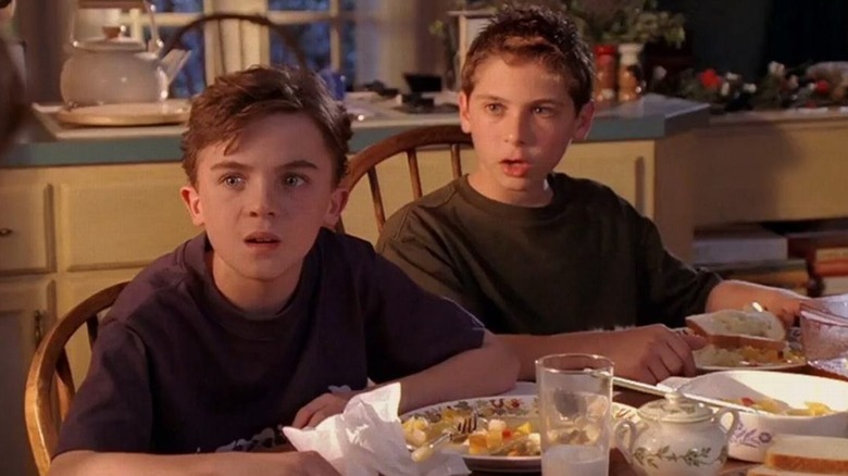 Young Reese and Malcolm at dinner