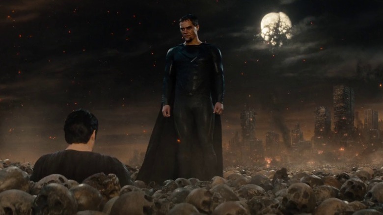 Clark sinking into a pile of skulls while Zod watches