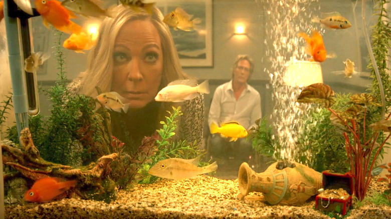 Bonnie Plunkett gazes into aquarium