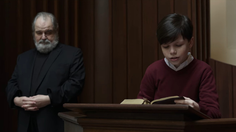 Young Craig reading in church