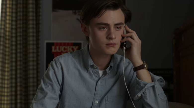 Jaeden Martell listening on the phone