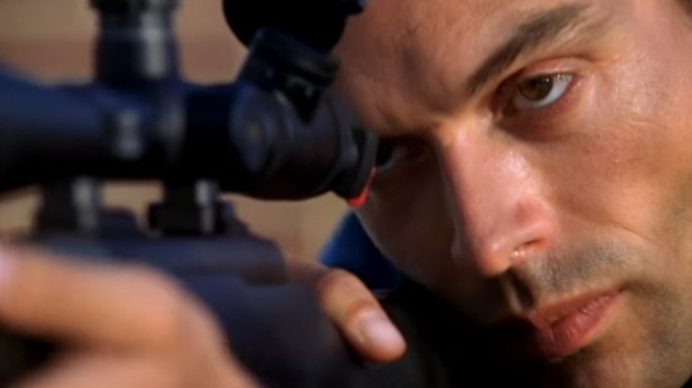 Ari aiming at Gibbs, Kate, and DiNozzo