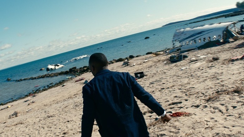 George standing on a beach