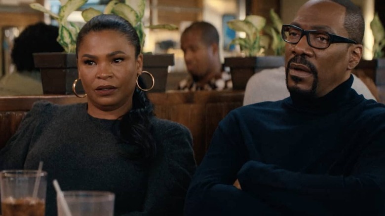 Nia Long and Eddie Murphy being skeptical at lunch