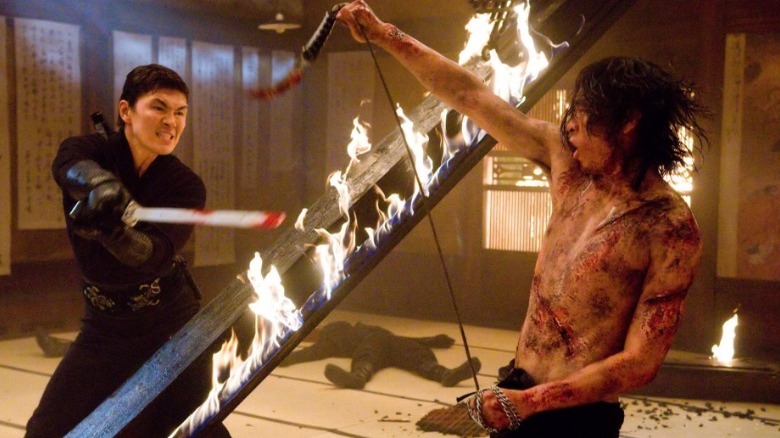 Raizo fighting Takeshi through flames