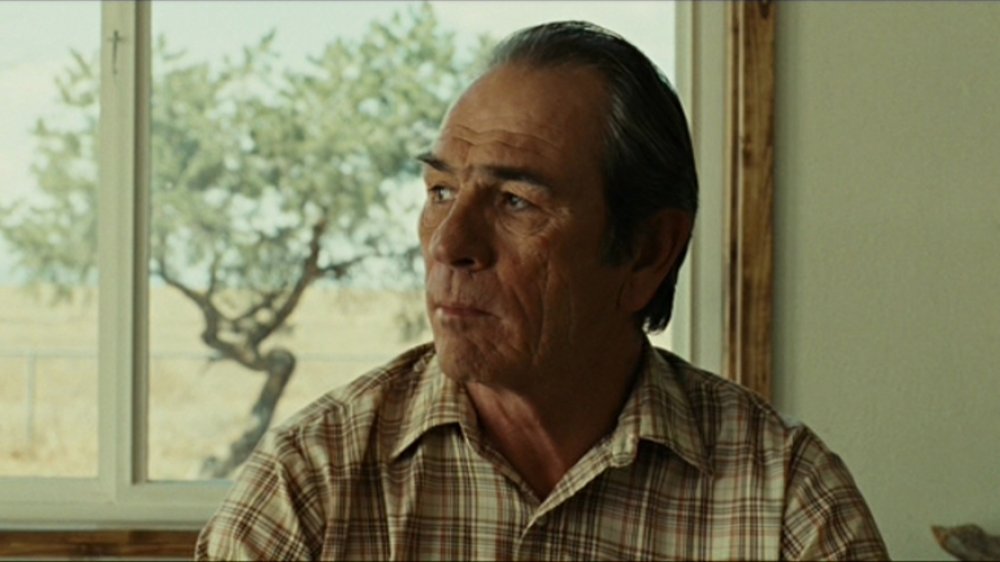 Tommy Lee Jones as Ed Tom Bell in No Country for Old Men