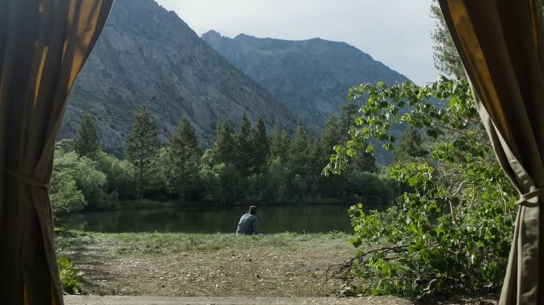 Man overlooking a lake