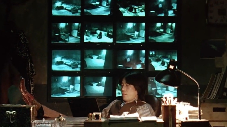 Park Cheol-woong sitting surveillance monitors Oldboy