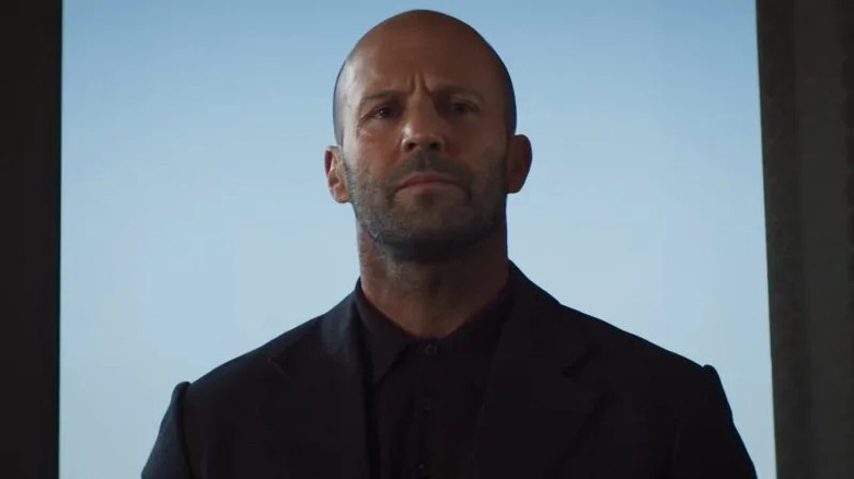 Jason Statham walking into room