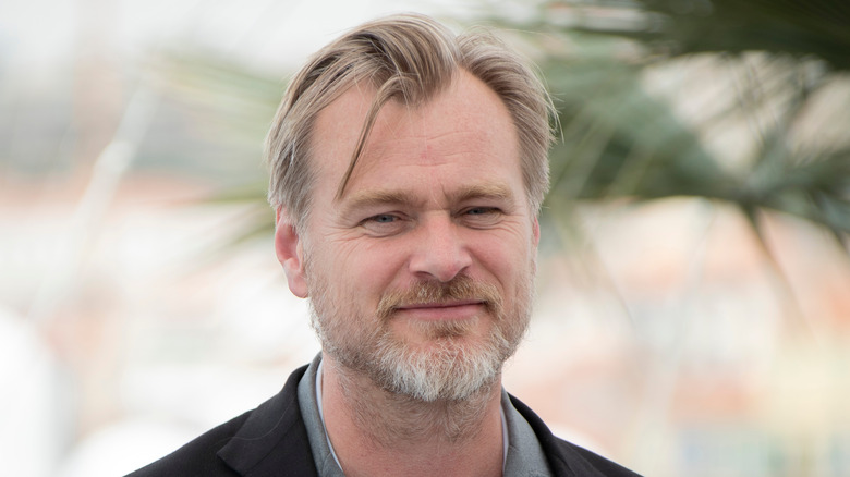 Christopher Nolan smiles