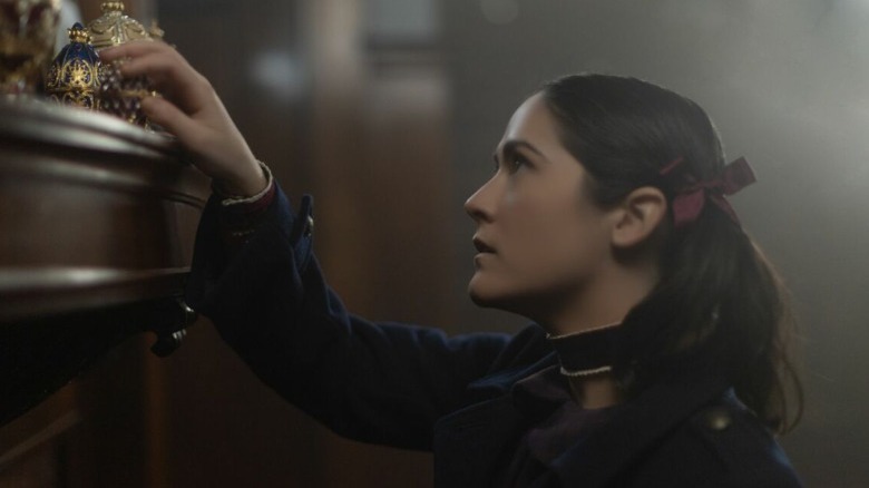 Leena investigates the knick-knacks on a mantle