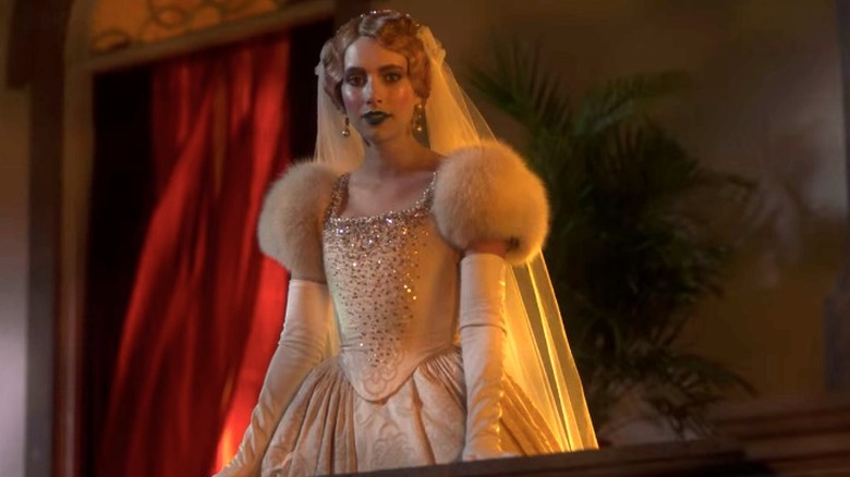 Emma Roberts as Anna in wedding gown on balcony, Paradise Hills