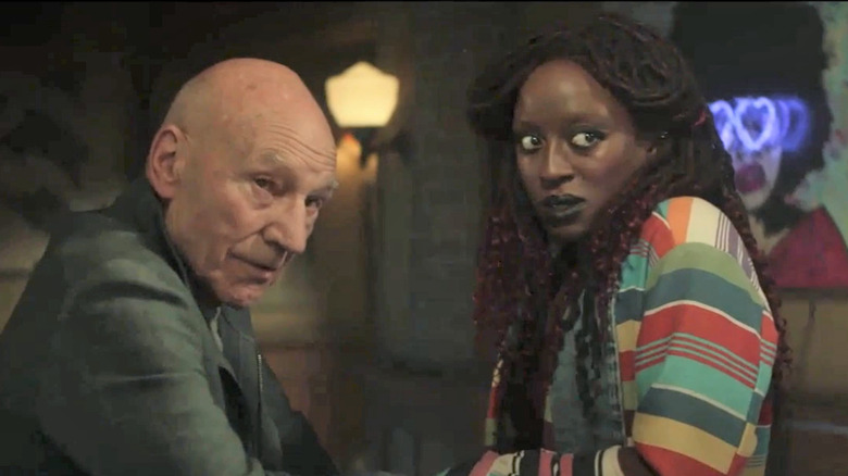 Picard and Guinan looking upset