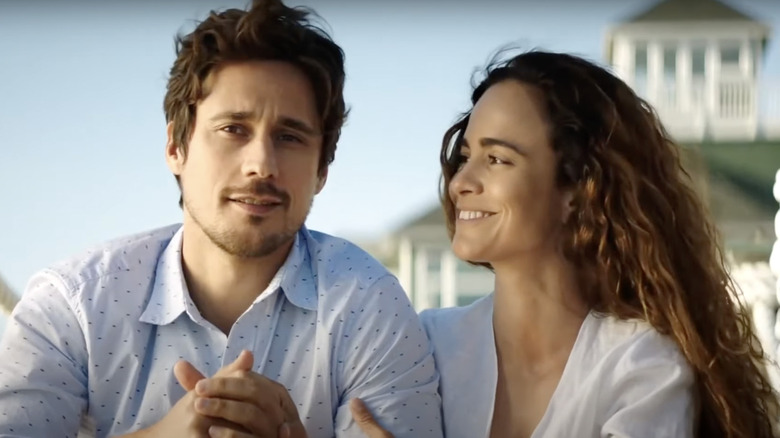 Teresa smiling at James on beach