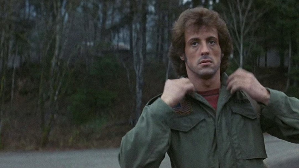 Sylvester Stallone John Rambo adjusting uniform