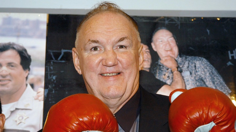 Chuck Wepner with pictures of Sylvester Stallone