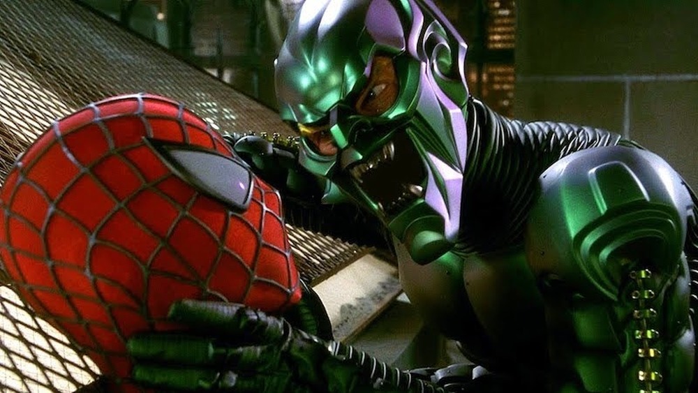 Willem Dafoe as Green Goblin grabbing Tobey Maguire's Spider-Man