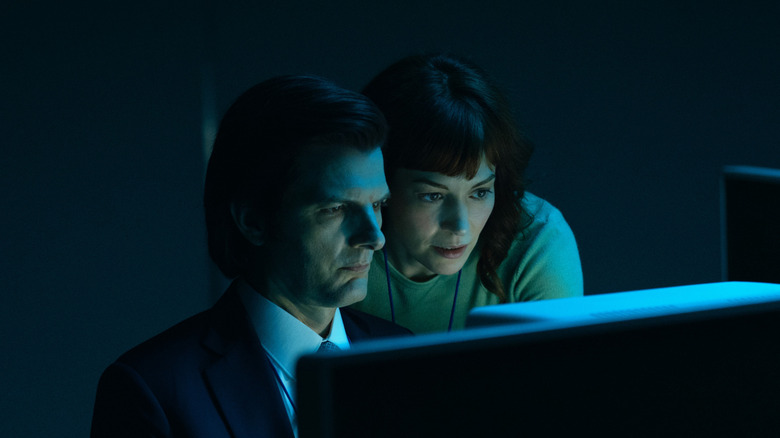 Helly watches Mark (Adam Scott) work on Severance (2025)