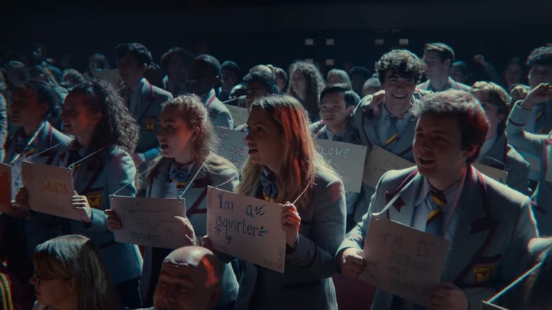 Students with shame signs