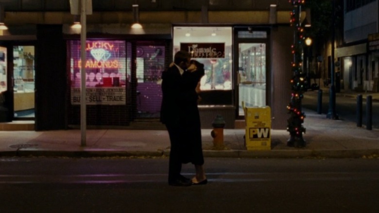 Tiffany and Pat kissing on the street