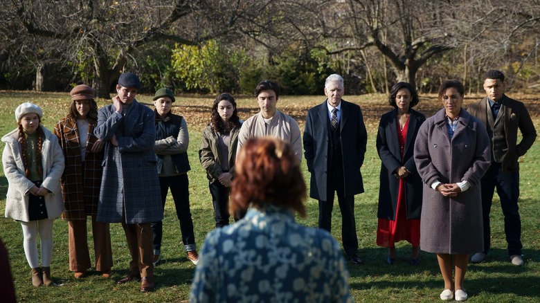 The Galloway Family lined up in front of trees