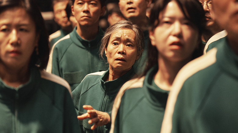 Geum-ja reaches out in the crowd