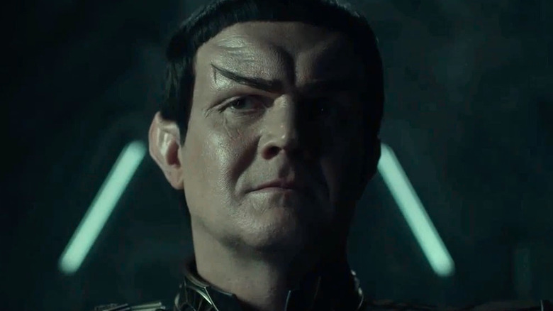 Romulan commander looks at Pike