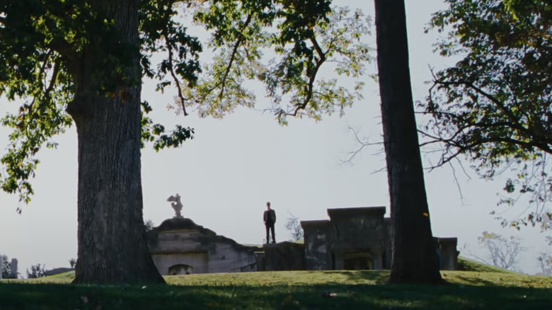 Charlie standing in the graveyard