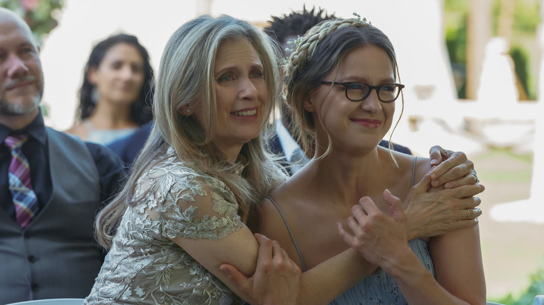 Kara and Eliza embrace at wedding